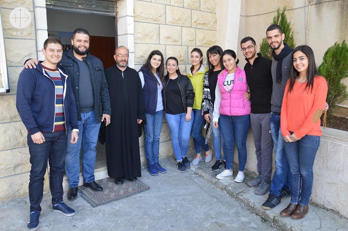Majd Jallhoum (first from the right), secretary of the Saint Peter Relief Centre, with the gruop of volunteers of the Saint Peter Relief Centre.