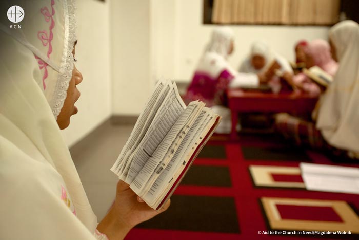 A girl reading Quran