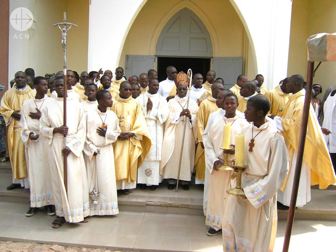 Bishop Ignace Bessi Dogbo with priests of his diocese