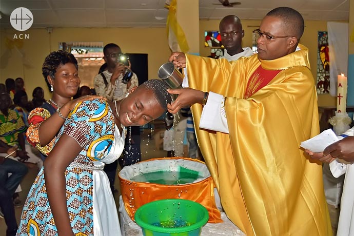 Adult baptism during holy mass.