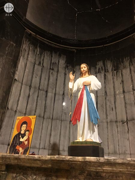 Chapel in St Mary’s church in Qaraqosh. The church has been damaged by ISIS. Now prayer has returned.