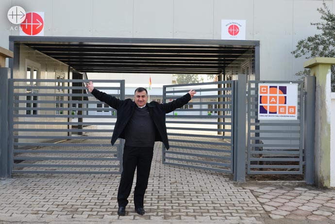 Archbishop Bashar Matti Warda at the gate to St. Mary's School at Mar Mar Qardakh Street