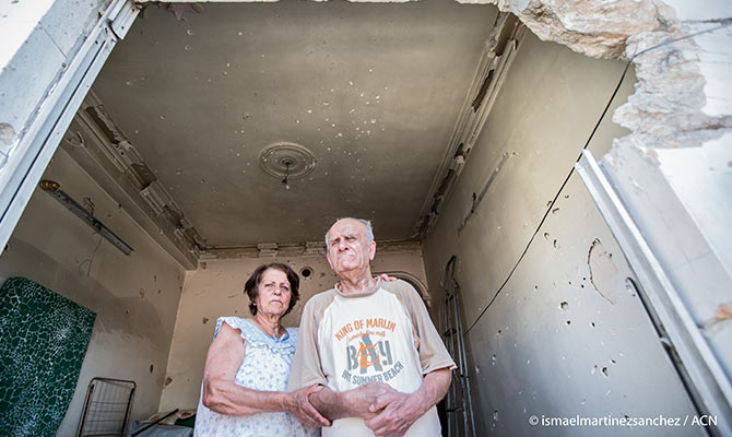 In their bombed-out home: Mary and her blind brother Sarkis live next door to the Jesuits.
