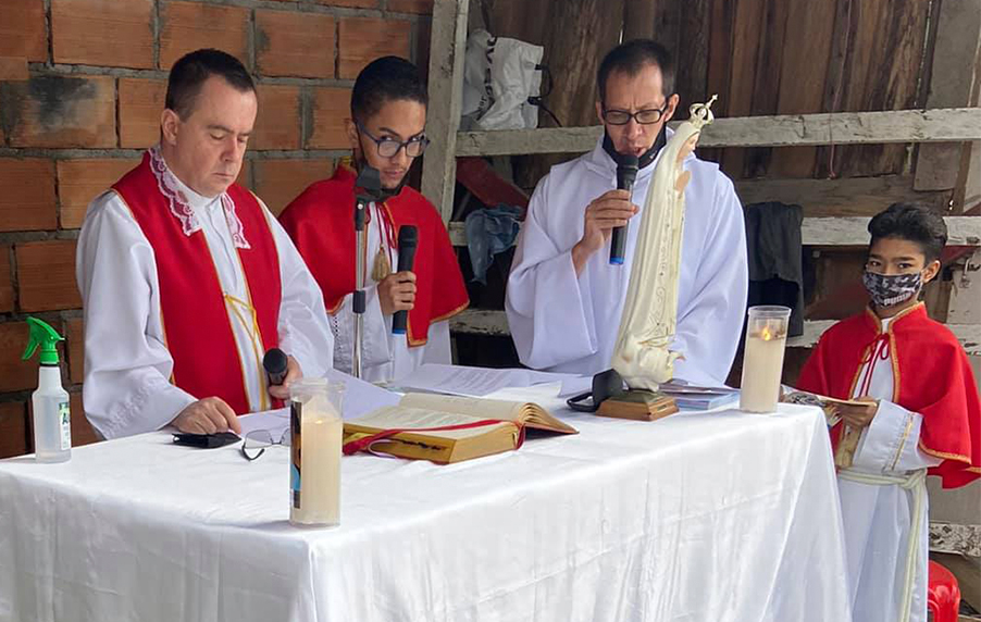 Priest celebrating holy mass in Colombia during the COVID-19 pandemic 