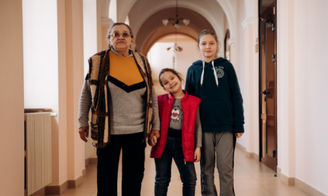 Grandmother Tetiana with her granddaughters Vasilisa and Ulyana.