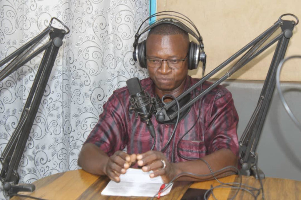 The Church in Burkina: a priest producing a radio programme.