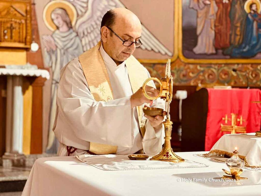 Father Gabriel Romanelli during the mass at Holy Family Church in Gaza