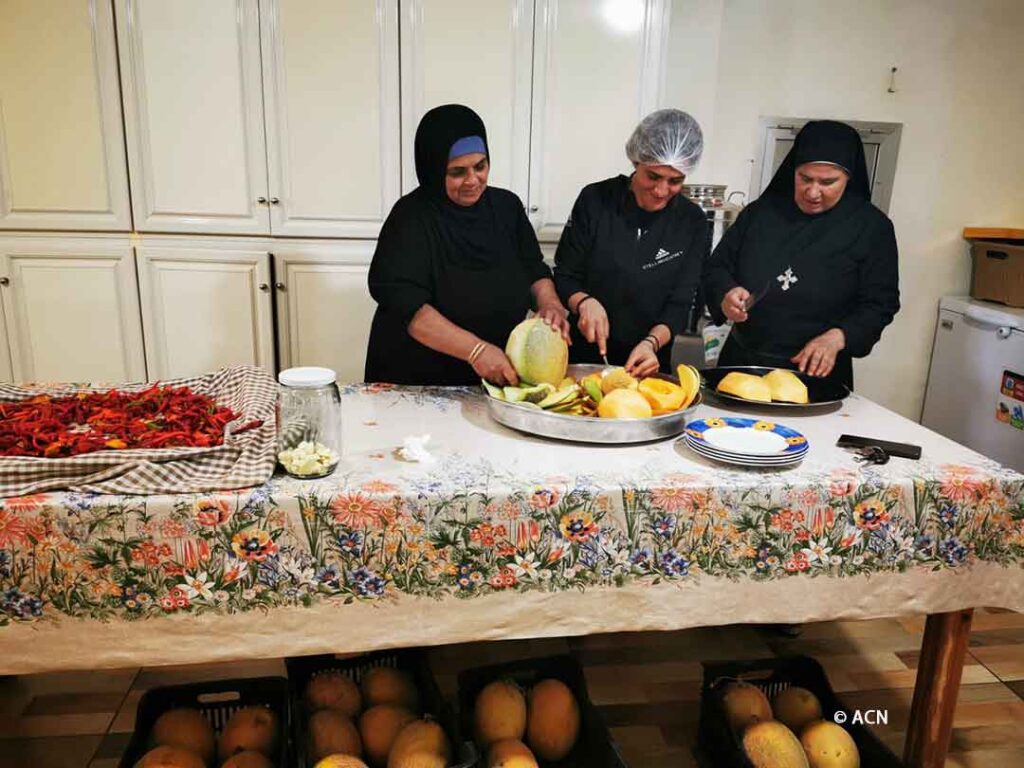 Internally displaced people help the sisters with daily tasks such as preparing meals for over 800 people
