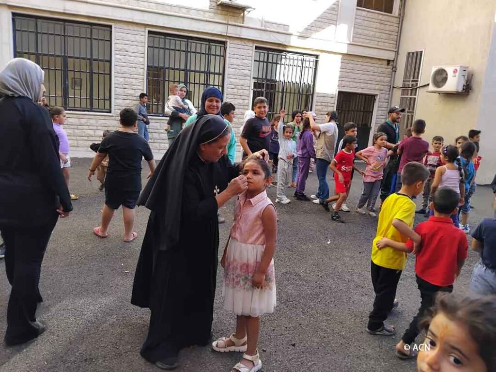 The sisters organise games for the children, providing moments of joy and normality in the midst of the difficult situation