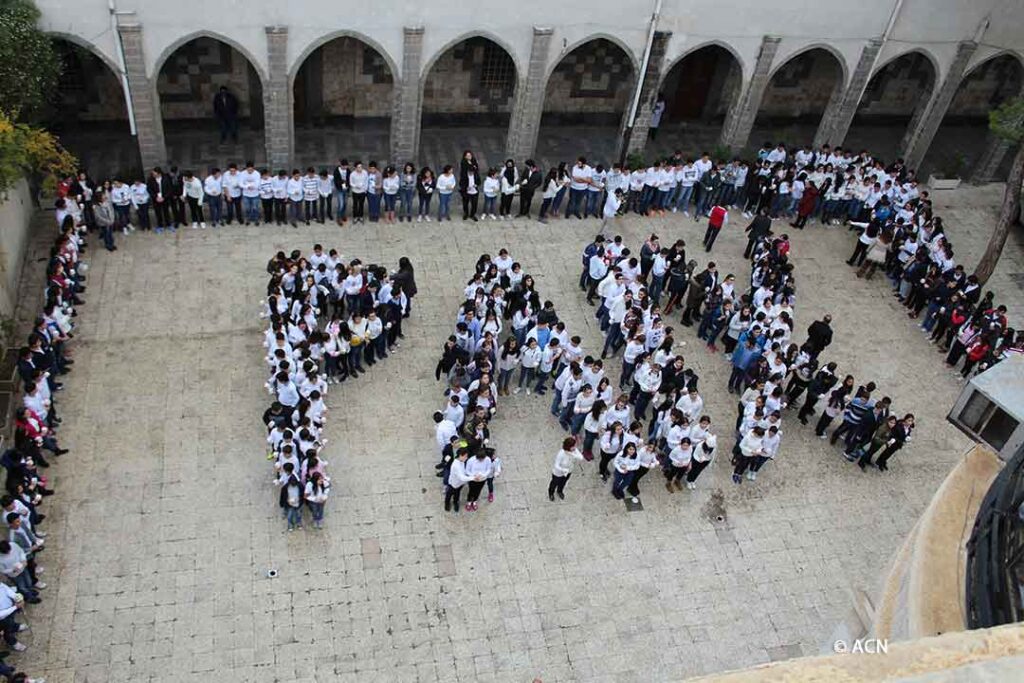 Christian students in Syria spell out the word “Paix”, French for Peace