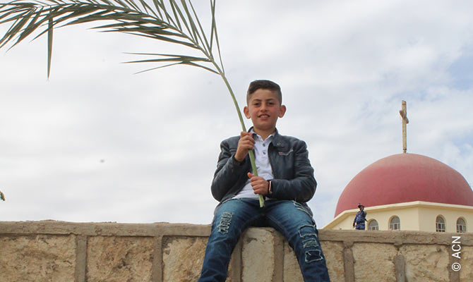 A boy at the Palm Sunday procession on 25.03.2018 in Qaraqosh, Iraq.